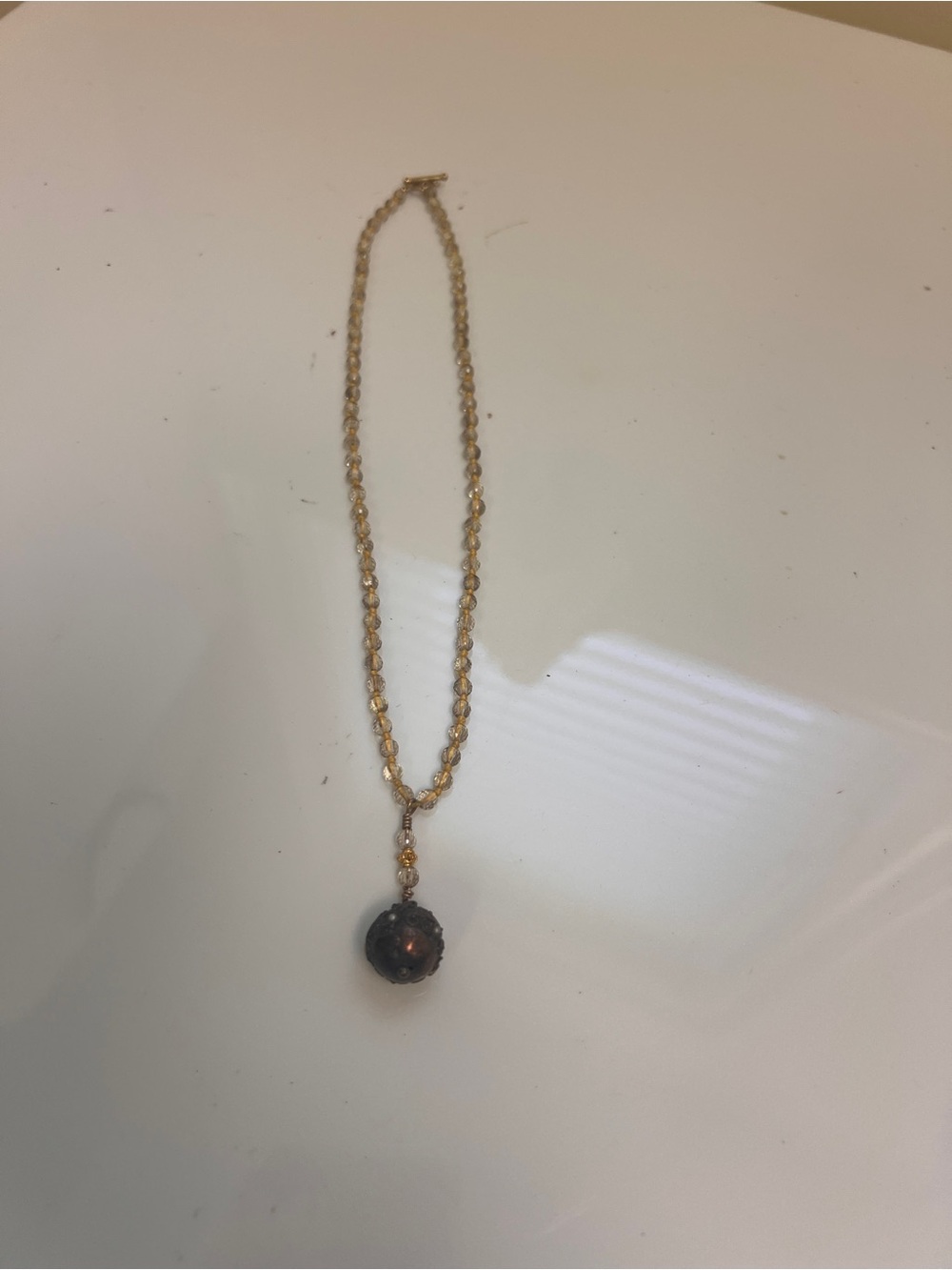 Gold-Tone Necklace with Dark Brown Pendant